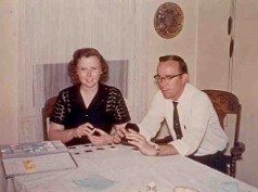 Jerry & Wanda arranging slide photos at home.